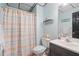 Cozy bathroom with decorative accents, a single sink vanity, and a shower at 7376 Bates Dr, Cumming, GA 30040
