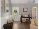 Welcoming entryway with hardwood floors, decorative accents, and natural light at 7376 Bates Dr, Cumming, GA 30040