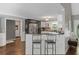 Stylish kitchen featuring stainless steel appliances and bar-style seating at 7376 Bates Dr, Cumming, GA 30040