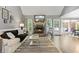 Inviting living room with fireplace, hardwood floors, and bright natural light at 7376 Bates Dr, Cumming, GA 30040
