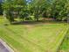 Large, well-maintained backyard enclosed by a chain-link fence, offering ample space for outdoor activities at 8415 Ridge Rd, Fairburn, GA 30213