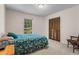 Bedroom featuring a large window, hardwood floors, natural light, and closet space at 8415 Ridge Rd, Fairburn, GA 30213