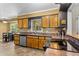 Functional kitchen with wood cabinets, durable countertops, and modern appliances at 8415 Ridge Rd, Fairburn, GA 30213