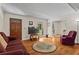 Inviting living room with hardwood floors, comfortable seating, and abundant natural light at 8415 Ridge Rd, Fairburn, GA 30213