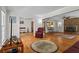 Open concept living room with hardwood floors, fireplace, and seamless flow to adjacent spaces at 8415 Ridge Rd, Fairburn, GA 30213