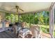Enjoy the outdoors on this screened-in porch with ceiling fan and natural light at 8415 Ridge Rd, Fairburn, GA 30213