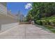 Home exterior featuring a concrete patio and well-manicured landscaping at 985 Laurel Springs Ln, Marietta, GA 30064
