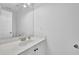 Clean bathroom with white cabinets, countertop and sink, ample mirror, and a white door at 985 Laurel Springs Ln, Marietta, GA 30064