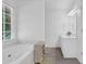 Relaxing bathroom with soaking tub and natural light at 985 Laurel Springs Ln, Marietta, GA 30064