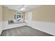 Cozy bedroom with neutral walls, gray carpet, and a window seat at 985 Laurel Springs Ln, Marietta, GA 30064
