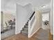 Inviting foyer with stairway and hardwood floors providing access to the dining room and another living space at 985 Laurel Springs Ln, Marietta, GA 30064