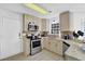 Bright kitchen with granite counters, stainless appliances, ample cabinet space, and a garden window above the sink at 985 Laurel Springs Ln, Marietta, GA 30064