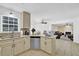 Open kitchen with granite counters, stainless dishwasher, and a view to a living space with a fireplace at 985 Laurel Springs Ln, Marietta, GA 30064