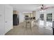 Bright eat-in kitchen with tiled floor, granite counters, stainless appliances, and access to outdoors through French doors at 985 Laurel Springs Ln, Marietta, GA 30064