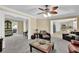 Open living space with fireplace, ceiling fan and connection to kitchen and dining areas with ample seating at 985 Laurel Springs Ln, Marietta, GA 30064