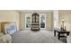 Spacious living area with ample natural light, antique decor, neutral carpeting, and classic furnishings at 985 Laurel Springs Ln, Marietta, GA 30064