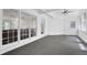 Sunroom featuring neutral carpeting, multiple windows, and white doors and trim at 985 Laurel Springs Ln, Marietta, GA 30064