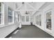 Bright sunroom featuring a ceiling fan, multiple windows, neutral carpeting and white trim at 985 Laurel Springs Ln, Marietta, GA 30064