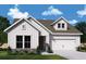 Charming single-Gathering home with white siding, a two-car garage, and manicured landscaping at 1049 Pine Bark Lane, Canton, GA 30114