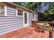 A backyard patio with a dining table and a door to the main house at 1268 Thomas Rd, Decatur, GA 30030