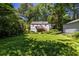 Spacious backyard with lush greenery, a deck, and mature trees for shade at 1268 Thomas Rd, Decatur, GA 30030