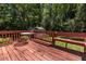 A backyard patio with built in bench seating and a shed in the background at 1268 Thomas Rd, Decatur, GA 30030