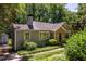 Well-maintained home with a stone facade, lush lawn, and mature shade trees at 1268 Thomas Rd, Decatur, GA 30030