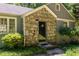 Close up of a stone facade entryway with well-manicured landscaping at 1268 Thomas Rd, Decatur, GA 30030