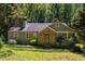 Charming single Gathering home featuring a stone accent entryway and mature landscaping at 1268 Thomas Rd, Decatur, GA 30030