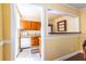 Kitchen view from dining room, showcasing tile floors and wood cabinets at 1268 Thomas Rd, Decatur, GA 30030