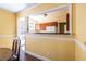 Kitchen view from dining room, showcasing cabinetry and appliances at 1268 Thomas Rd, Decatur, GA 30030