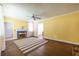 Spacious living room featuring hardwood floors, and bright yellow walls at 1268 Thomas Rd, Decatur, GA 30030