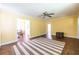 Spacious living room with hardwood floors, a ceiling fan, and lots of natural light at 1268 Thomas Rd, Decatur, GA 30030