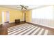 Open living room with bright windows, ceiling fan, and hardwood floors at 1268 Thomas Rd, Decatur, GA 30030