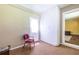 A room with chair and whitewashed brick accent wall at 1268 Thomas Rd, Decatur, GA 30030