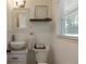 This bathroom features a toilet, a floating shelf, and a vessel sink at 2164 Medfield Trl, Atlanta, GA 30345