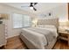 Bedroom features hardwood floors, natural light, and neutral decor at 2164 Medfield Trl, Atlanta, GA 30345
