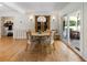 Bright dining room with wood floors, updated lighting fixture, and slider door to backyard at 2164 Medfield Trl, Atlanta, GA 30345