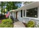 Inviting front porch with well-maintained landscaping and an American flag at 2164 Medfield Trl, Atlanta, GA 30345