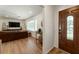Open-concept living area with hardwood floors, a view of the front door and lots of natural light at 2164 Medfield Trl, Atlanta, GA 30345