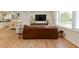 Bright living room featuring hardwood floors, large windows, and stylish furnishings at 2164 Medfield Trl, Atlanta, GA 30345
