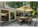 Outdoor patio with stamped concrete, large umbrella, and direct access to the dining room at 2164 Medfield Trl, Atlanta, GA 30345