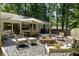 Entertain in this outdoor space featuring a patio, fire pit, and string lights at 2164 Medfield Trl, Atlanta, GA 30345