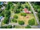 Aerial view showcasing the expansive land, swimming pool, and various buildings on the property at 4545 Gaydon Rd, Powder Springs, GA 30127