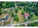 Aerial view showcases multiple homesites, surrounded by lush greenery with a community pool nearby at 4545 Gaydon Rd, Powder Springs, GA 30127