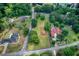 Aerial view highlighting property lines on a large lot with multiple homes and community pool at 4545 Gaydon Rd, Powder Springs, GA 30127