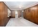 Paneled bedroom featuring a ceiling fan, carpeted floors, and an exterior door at 4545 Gaydon Rd, Powder Springs, GA 30127
