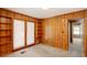 Bedroom with built-in shelves, closet, and carpet flooring at 4545 Gaydon Rd, Powder Springs, GA 30127