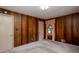 Bedroom with paneled walls, windows with pink curtains, and neutral carpeting at 4545 Gaydon Rd, Powder Springs, GA 30127