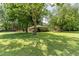 Spacious front yard featuring mature trees, green lawn, and a well-maintained ranch-style home at 4545 Gaydon Rd, Powder Springs, GA 30127